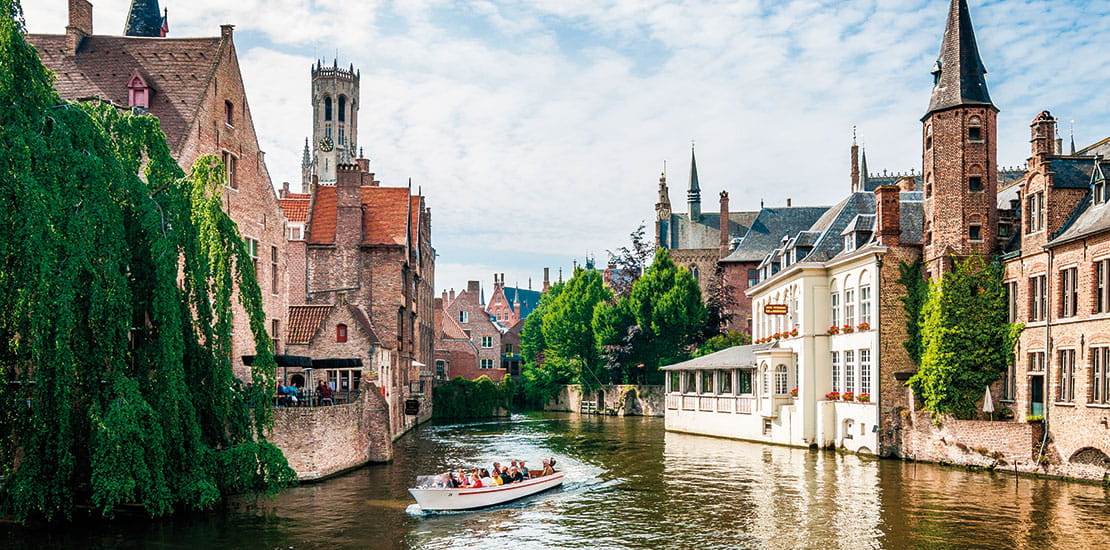 Bruges canal framed by traditional architecture, Belgium